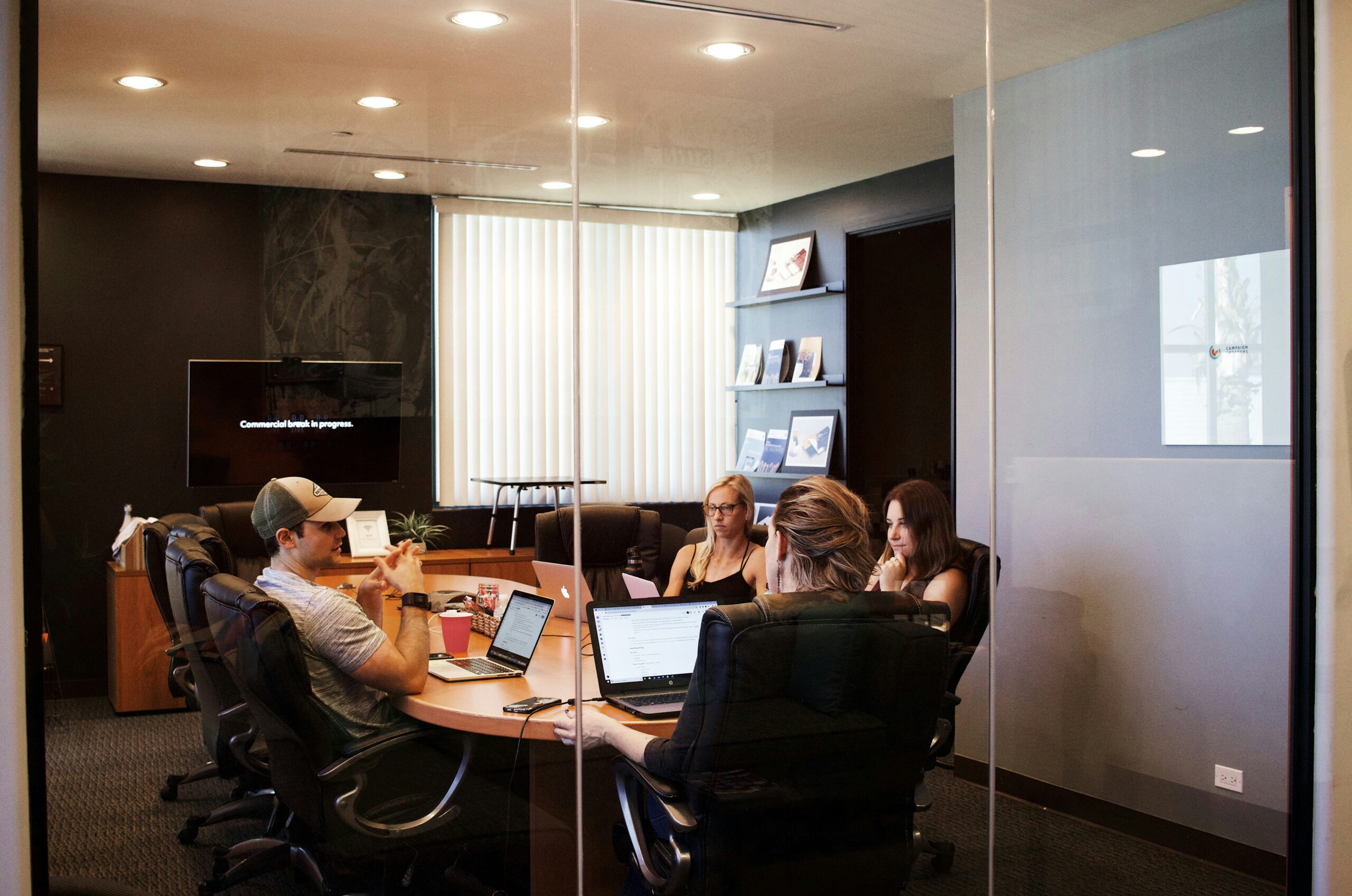 a group of people sitting in a conference room